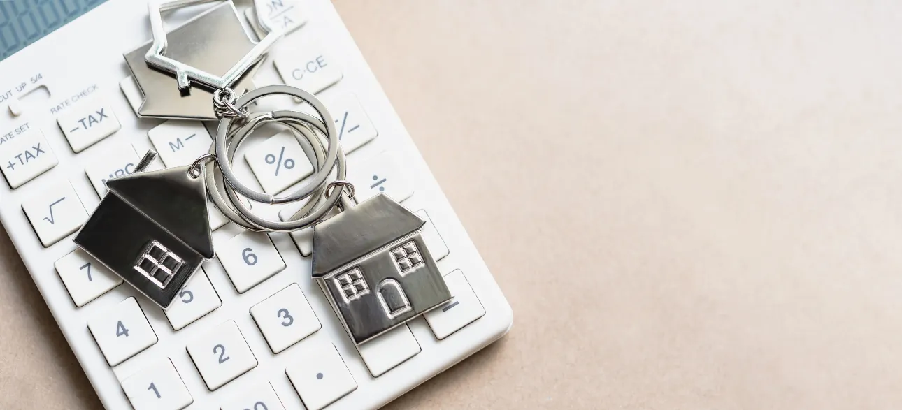 Calculator with house keychains — mortgage pre-approval
